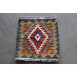 An approx. 1'5" x1'5" Chobi Kelim rug