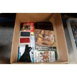 A box of playing cards and bridge related items