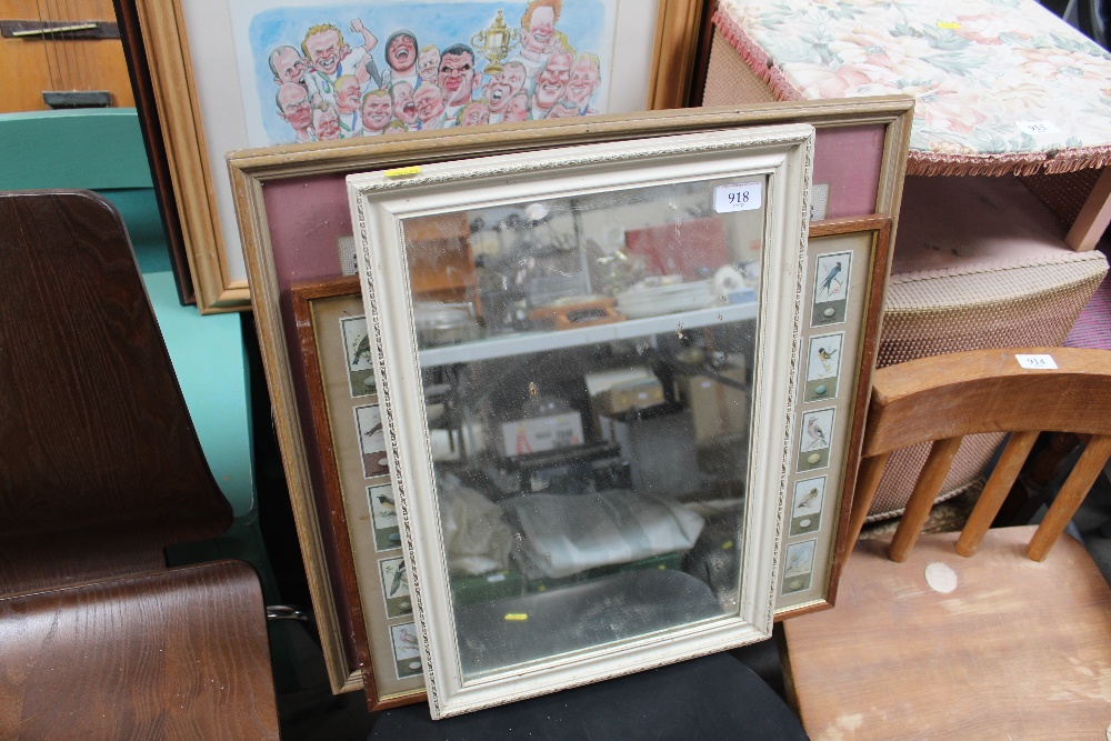 A framed collection of cigarette cards; a needlewo