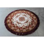 An approx. 4'11" diameter circular rug