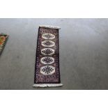 An approx. 2'8" x 1' Morijaldar rug