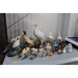 A collection of various bird and duck ornaments