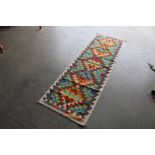 An approx. 6'6" x 2' Chobi Kelim rug