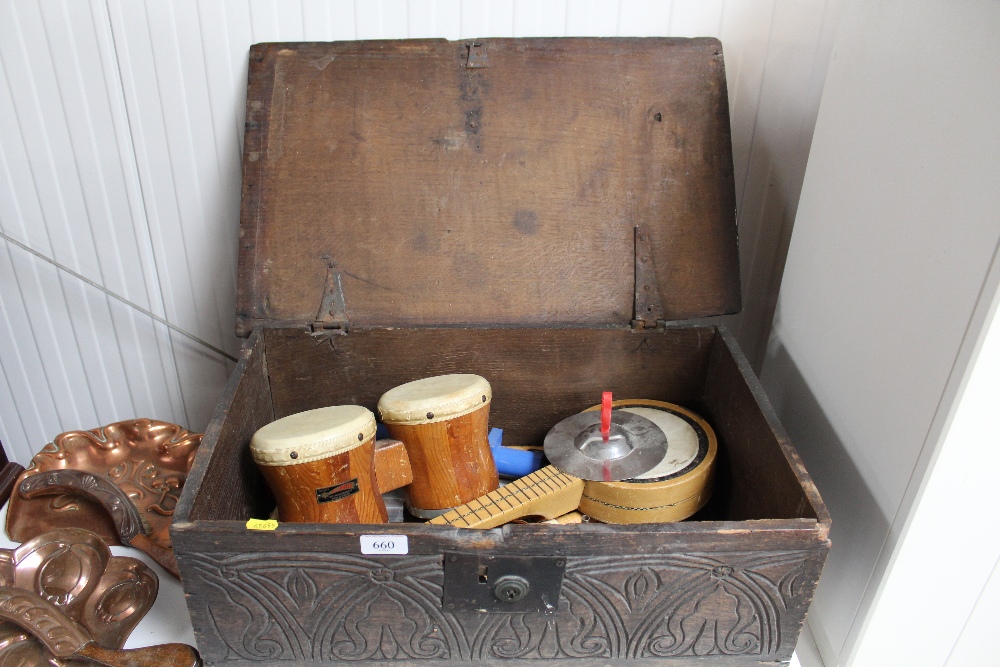 An antique carved oak Bible box and contents, various musical instruments etc.