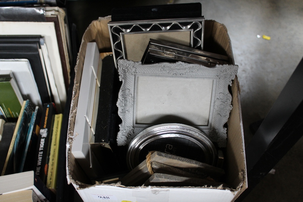 A box of various picture frames