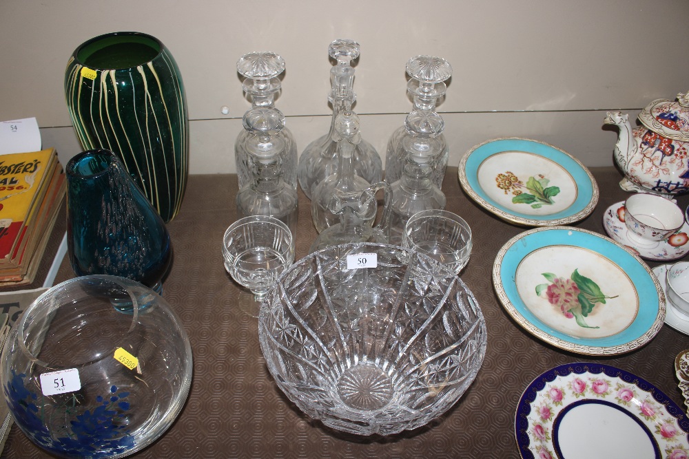 A quantity of cut glass decanters; a cut glass bow