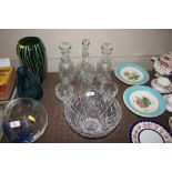 A quantity of cut glass decanters; a cut glass bow