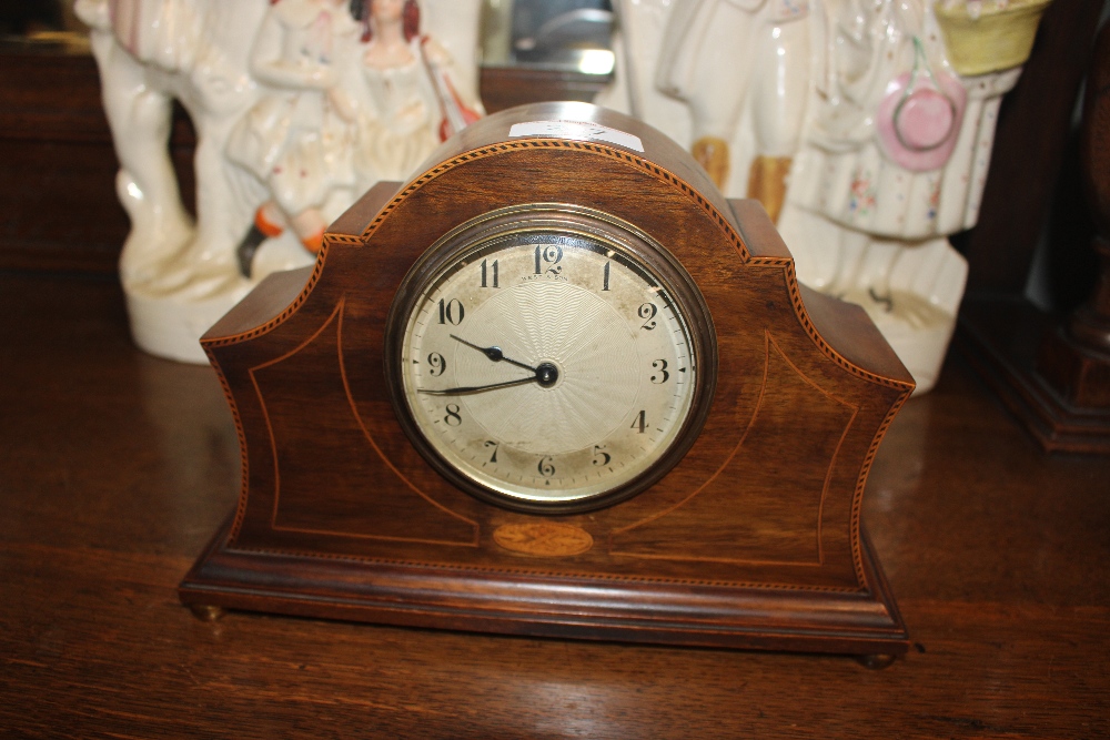 An Edwardian inlaid mahogany mantel timepiece of a