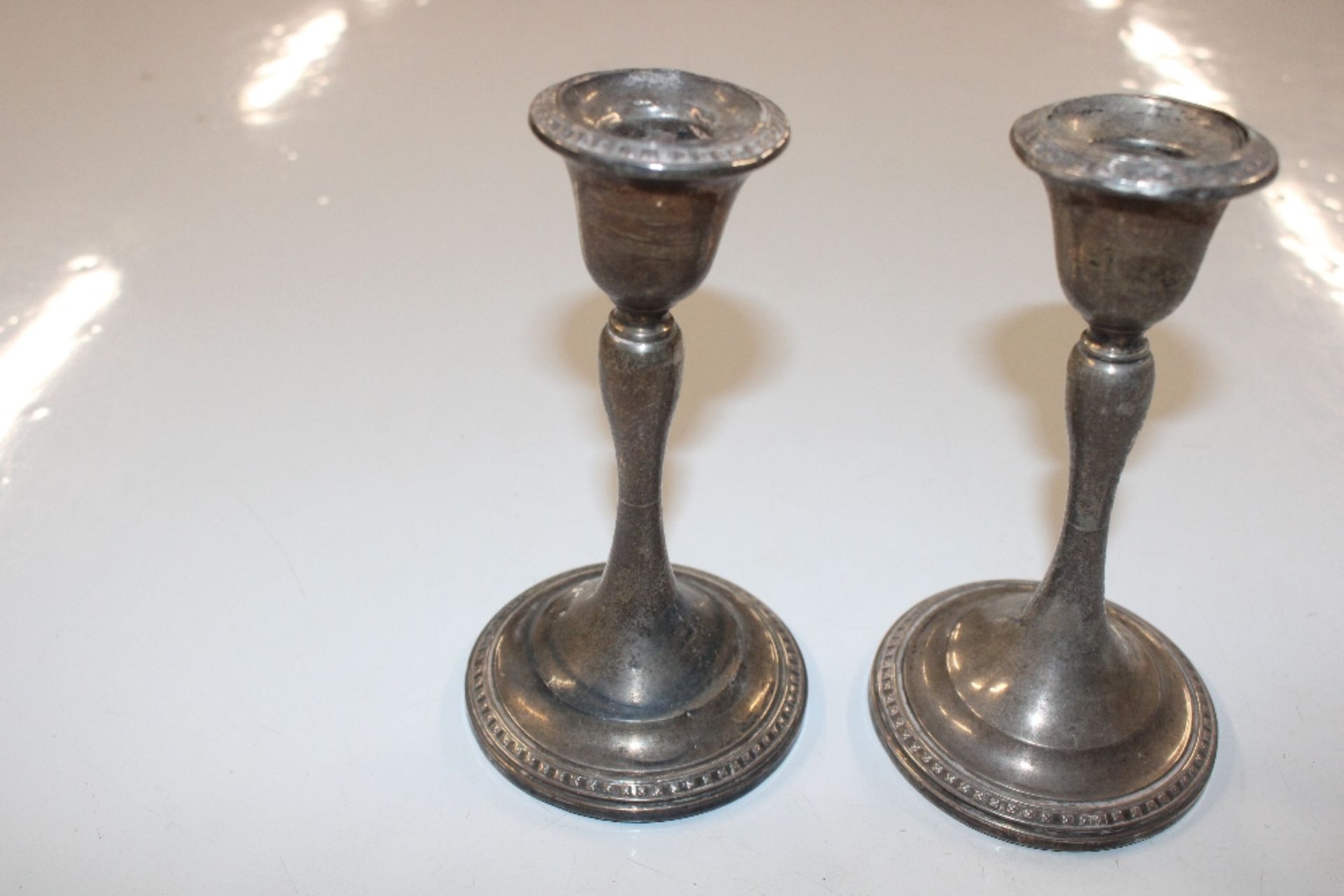 A pair of silver candlesticks with weighted bases - Image 5 of 7