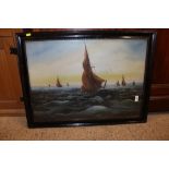 A framed and glazed oil depicting barges at sea, i