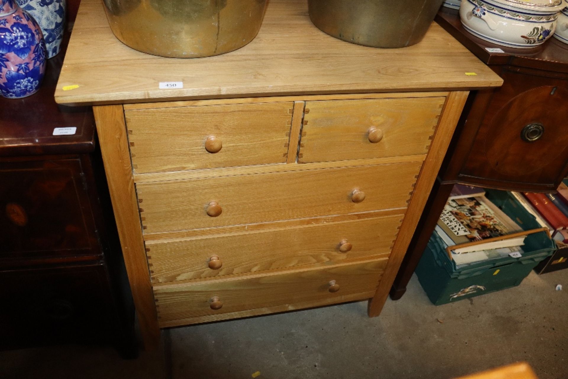 An oak effect chest fitted two short over three lo