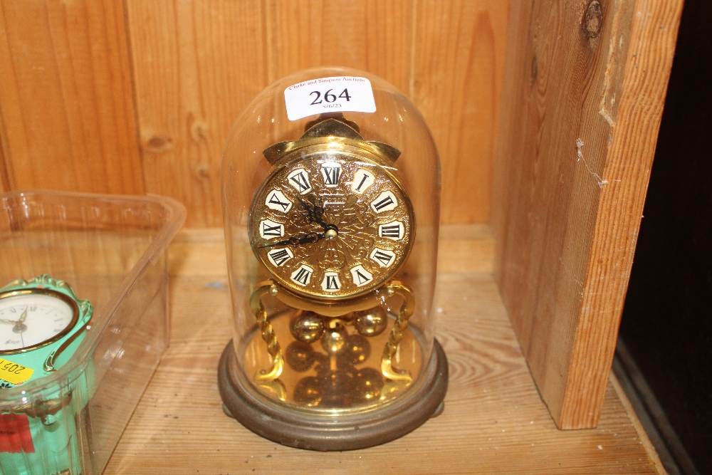 An anniversary clock contained in glass dome; and - Image 4 of 5