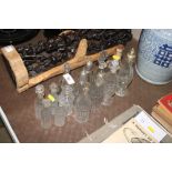 A quantity of various glass cruet bottles