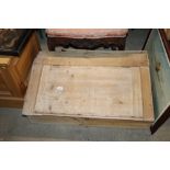 An antique stripped pine desk top writing slope