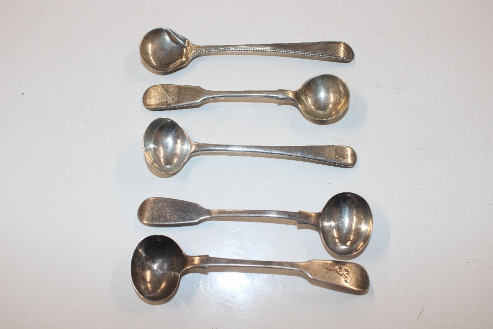 Four silver spoons, approx. weight 35gms; and a si