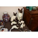 Six Beswick Siamese cat figures