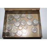 A tin of mostly silver coinage