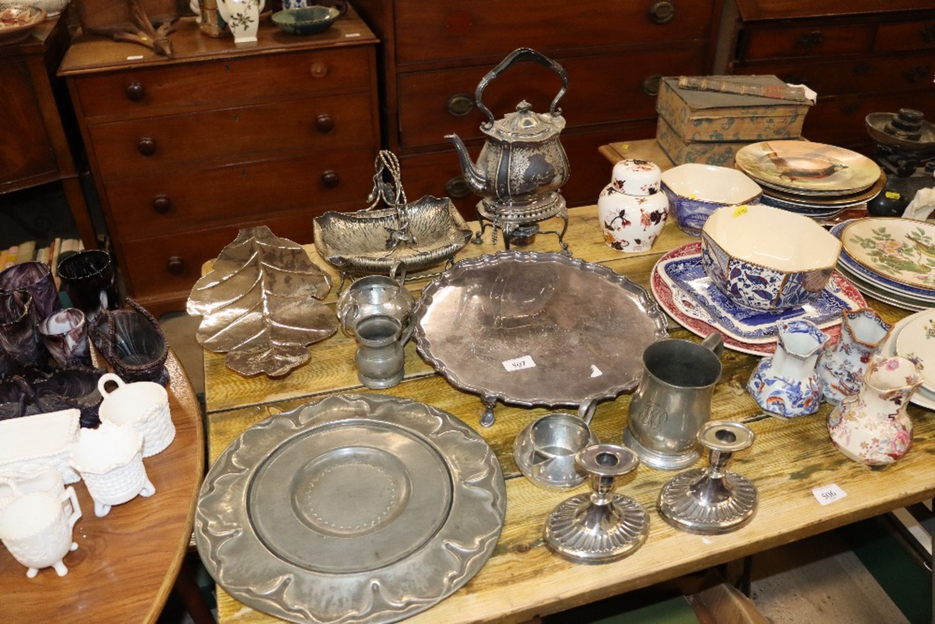 A plated tea kettle on stand; am plated fruit bask