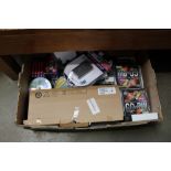 A box containing various CDs; computer keyboards;