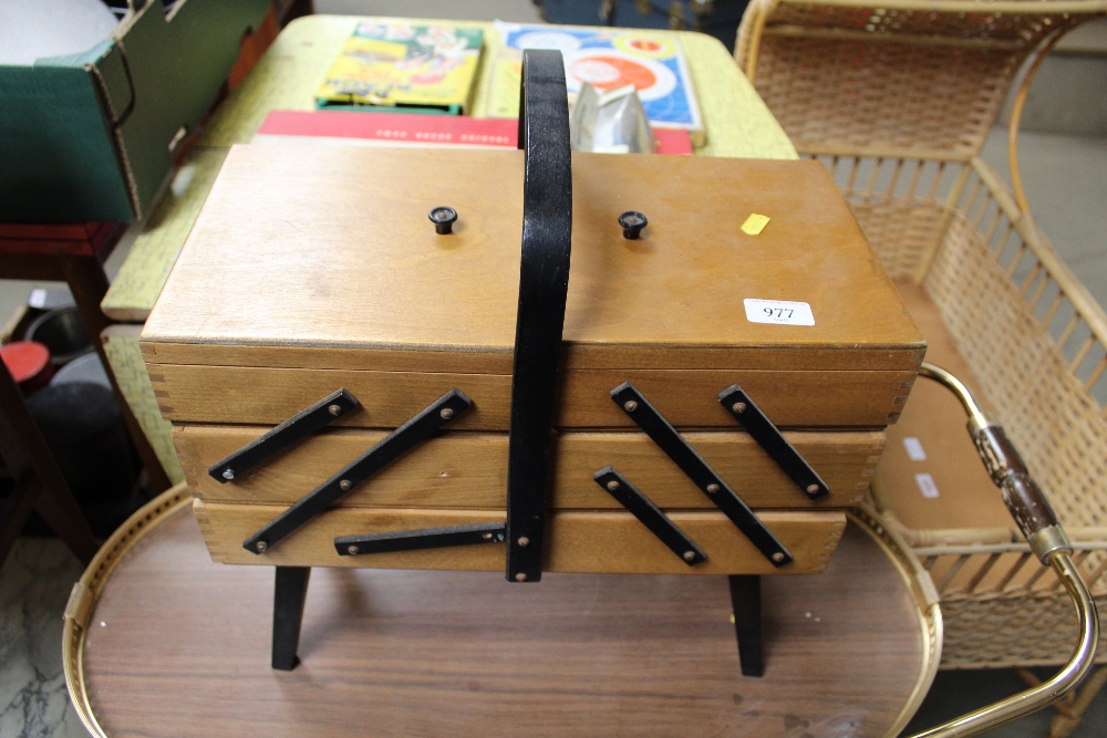 A cantilever sewing box and contents