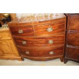 An antique mahogany bow front chest fitted two sho