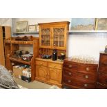 A pine dresser raised on cupboard base fitted two drawers