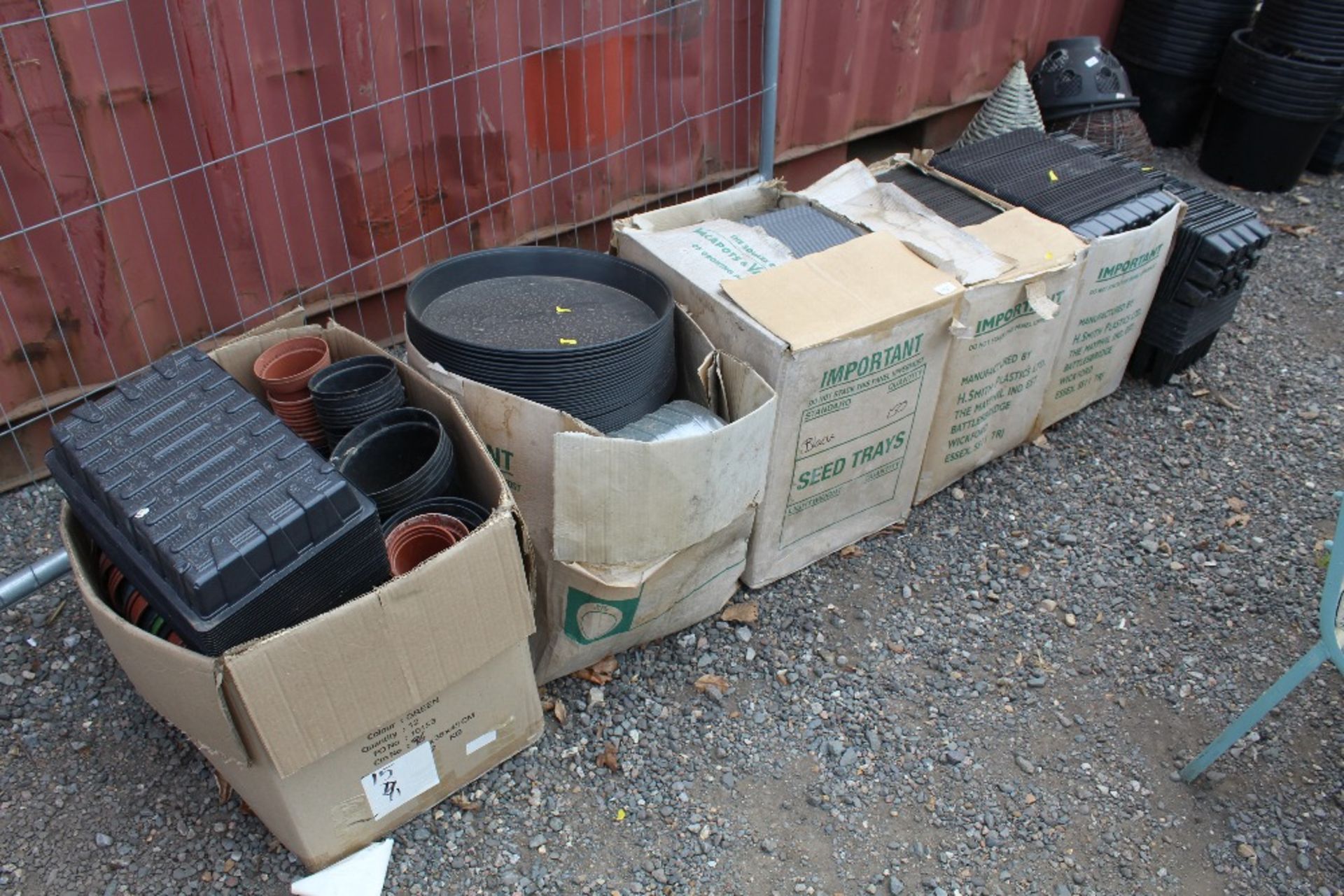 A large quantity of plastic plant pots and seed tr