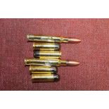 Six brass bullet pen knives