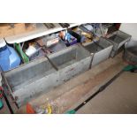 Three galvanised troughs