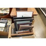 A box containing various pictures and prints