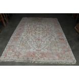 An approx. 9'7" x 6' red and blue patterned rug