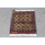 An approx. 1'5" x 1'6" Mori Jalda rug