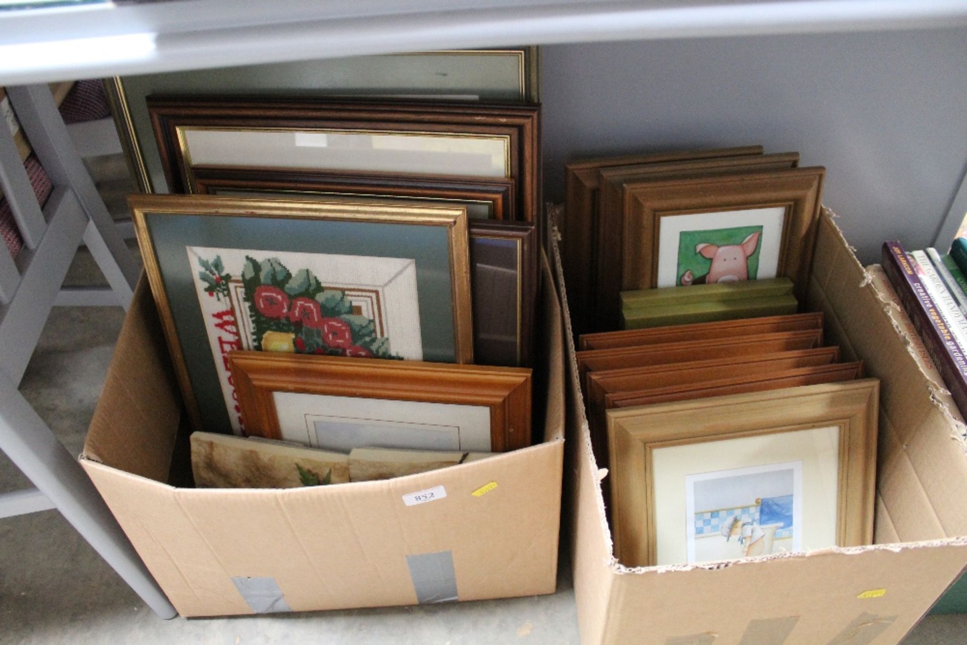 Two boxes containing various pictures and prints t