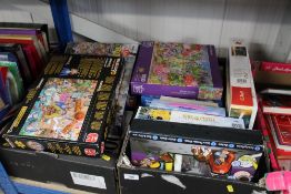 A box containing various puzzles (unknown if compl