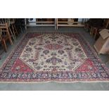 An approx. 10'7" x 9' blue and red patterned rug