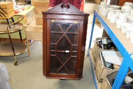 A mahogany corner cupboard