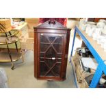 A mahogany corner cupboard