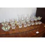 A quantity of coloured stem drinking glasses etc.