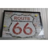 A Route 66 illuminated sign