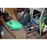 Two watering cans and a shoe rack