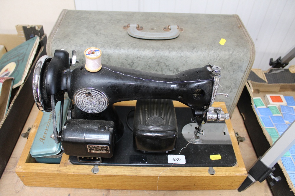 A sewing machine - sold as collector's item