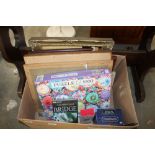 A box containing a puzzle, various picture frames