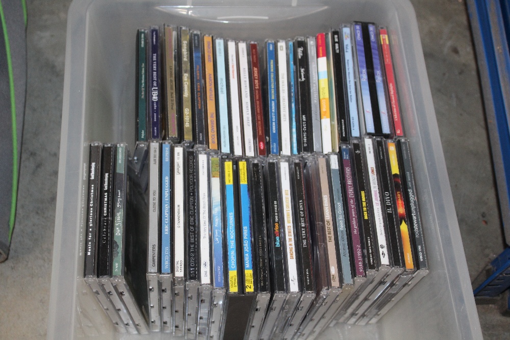 A box of various CD's