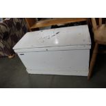 A white painted wooden storage chest