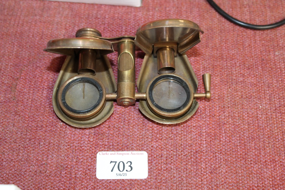 A pair of reproduction brass folding binoculars