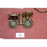 A pair of reproduction brass folding binoculars
