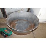 A twin handled galvanised bath