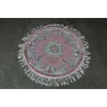 An approx. 3'8" diameter circular rug