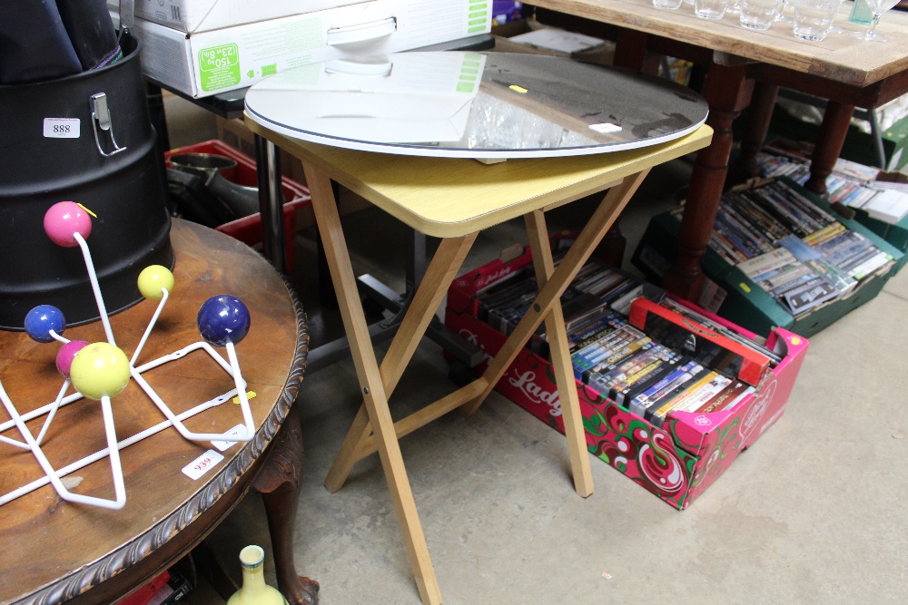 A bed tray and a folding table together with a fra