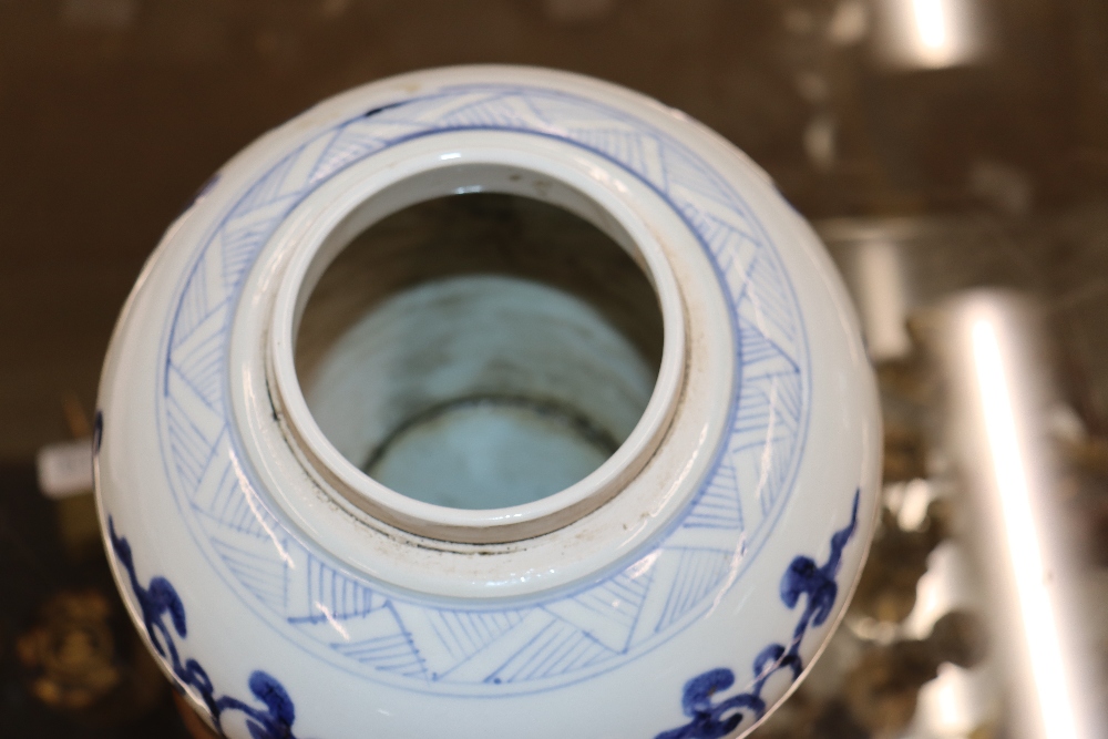 A Chinese blue and white ginger jar and cover, decorated flowers and calligraphy, 21cm high - Image 7 of 24